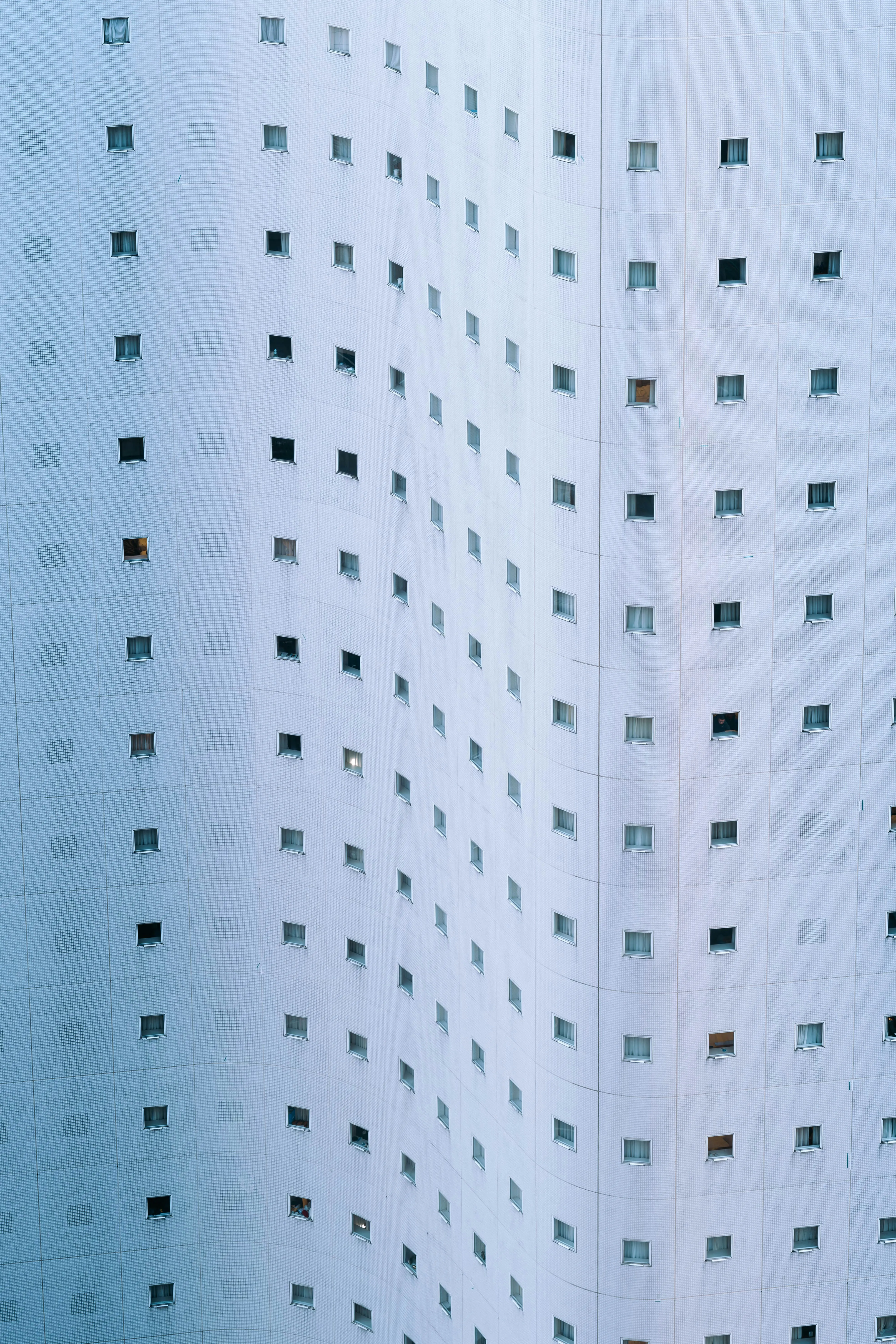 Hypnotic Urban Rhythms: Modern Building Facade with Grid Windows
