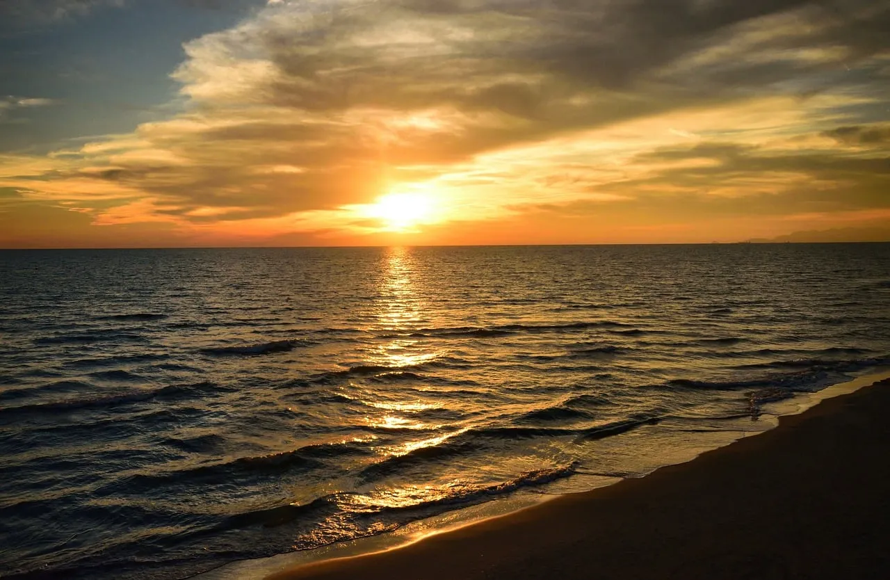 Breathtaking Tuscan Sunset Over the Tranquil Italian Coast
