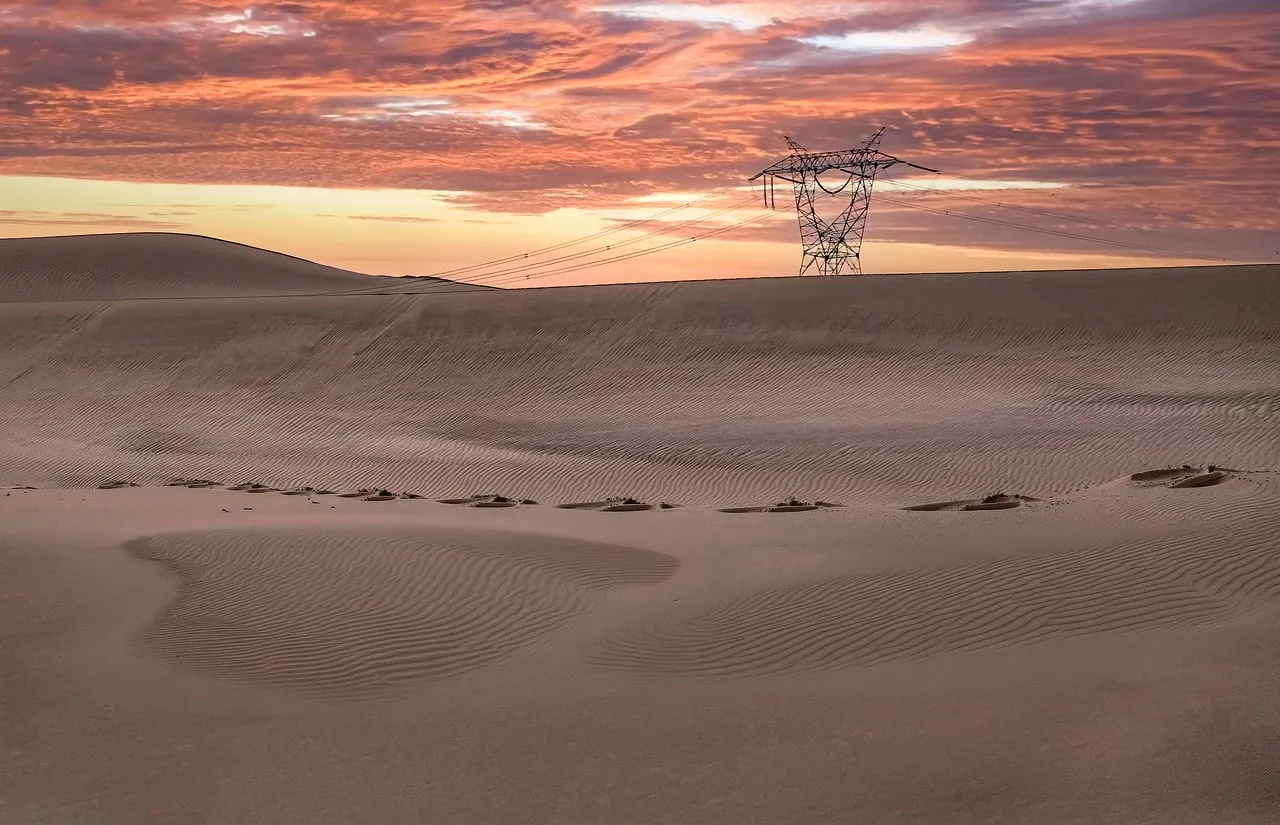 Dramatic Desert Sunset: Powering Through Remote Sand Dunes