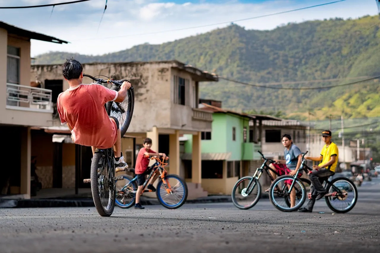 Adrenaline-fueled Wheelie: Youthful Biking in Mountain Town