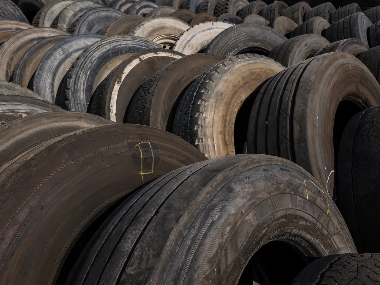 Massive Tire Graveyard: Industrial Waste & Recycling Background