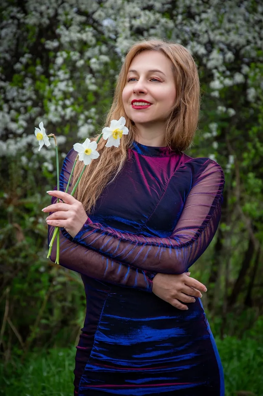 Radiant Blonde in Bloom: Spring Elegance with Daffodils