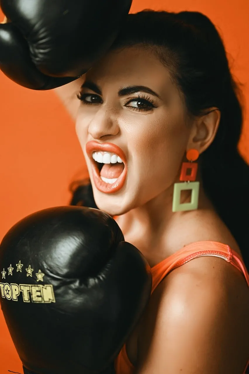 Fiery Punch: Determined Woman with Boxing Gloves