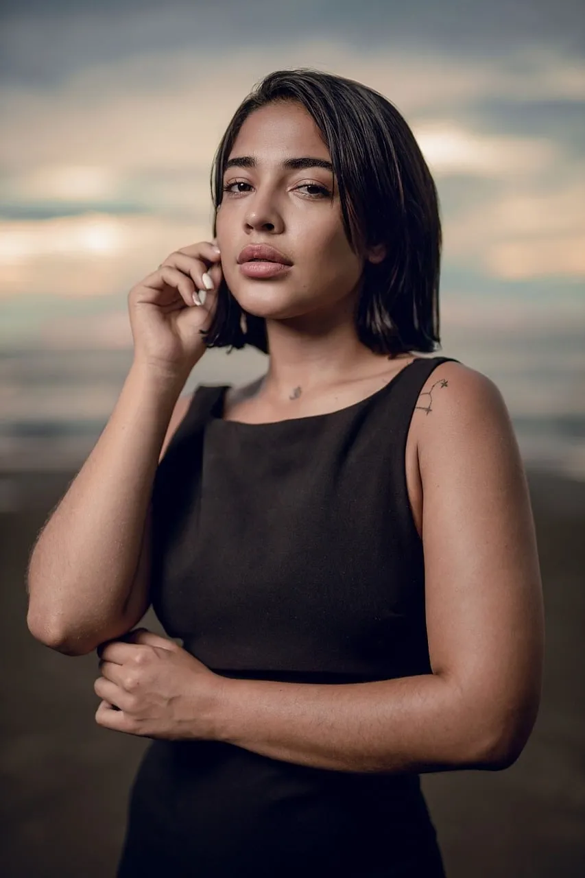 Enchanting Beach Sunset: Young Woman's Serene Evening Portrait