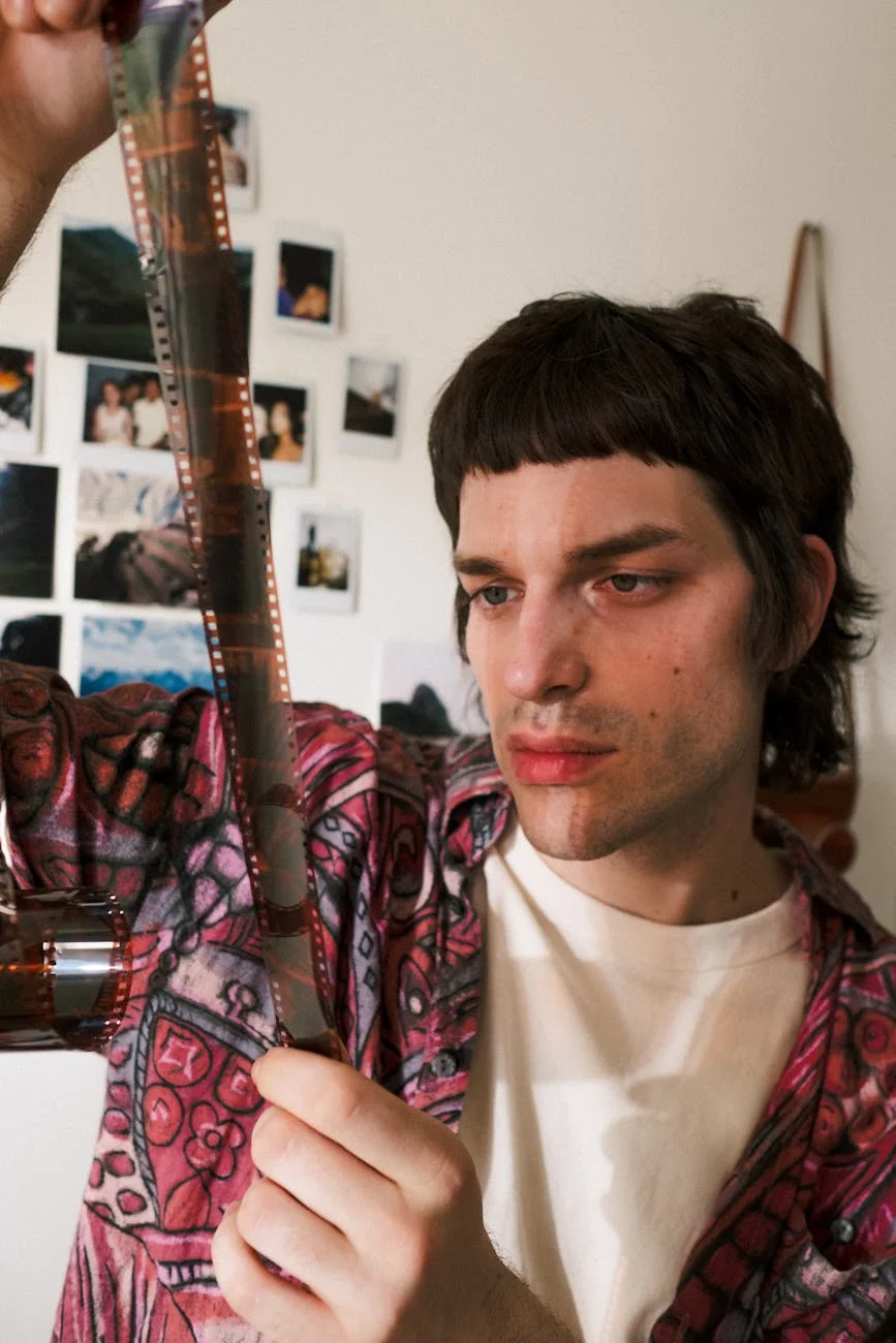 Nostalgic Gaze: Man Reviews Film Strip Memories