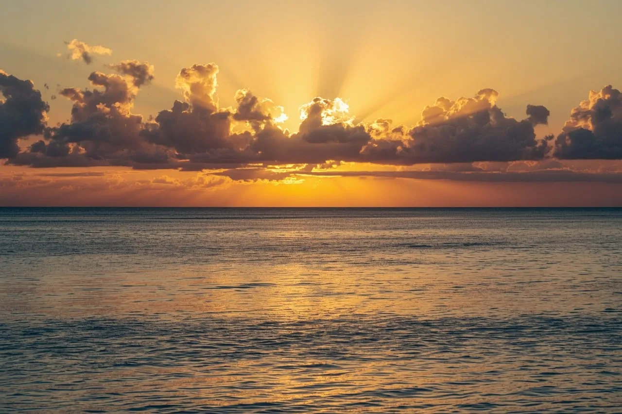 Golden Hour Serenity: Ocean Sunset with Radiant Sun Rays