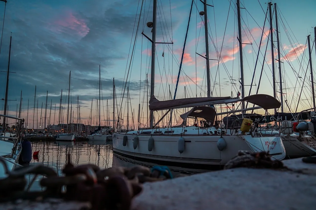 Breathtaking Italian Harbor Sunset: Yachts & Serene Reflections