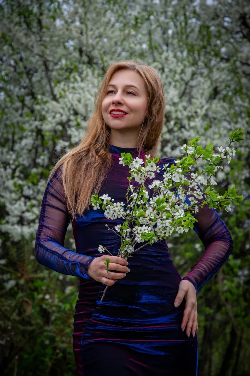 Enchanting Spring Blossom Portrait: Woman in Blooming Garden