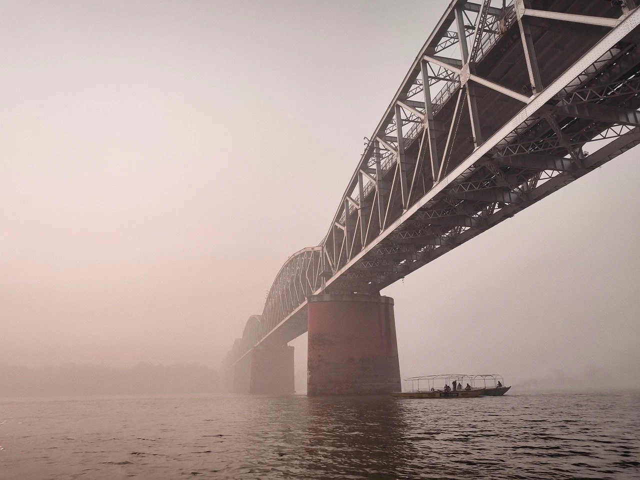 Mystical Ganges Bridge: A Foggy Varanasi Sunset Scene