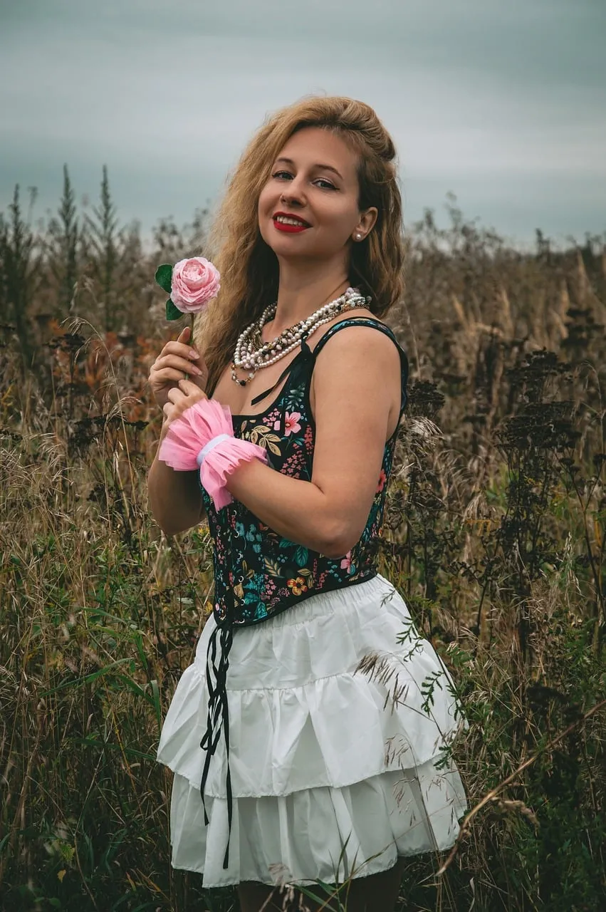Enchanting Blonde in Floral Corset Amidst Autumn Fields