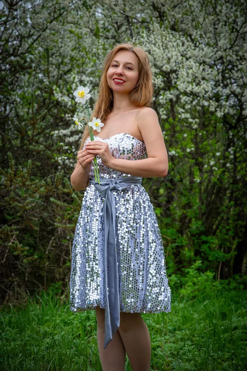 Radiant Spring Beauty: Sequin Dress Amidst Blossoms