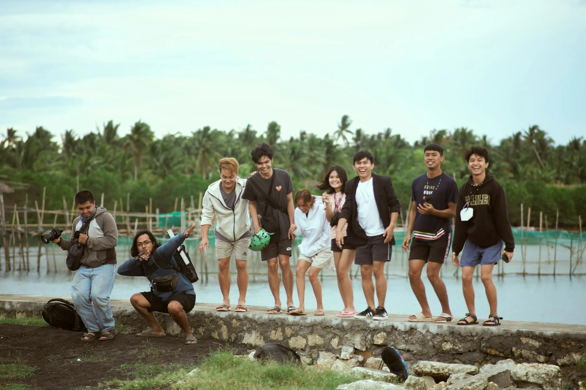 Joyful Group Portrait: Friends Posing by the Water