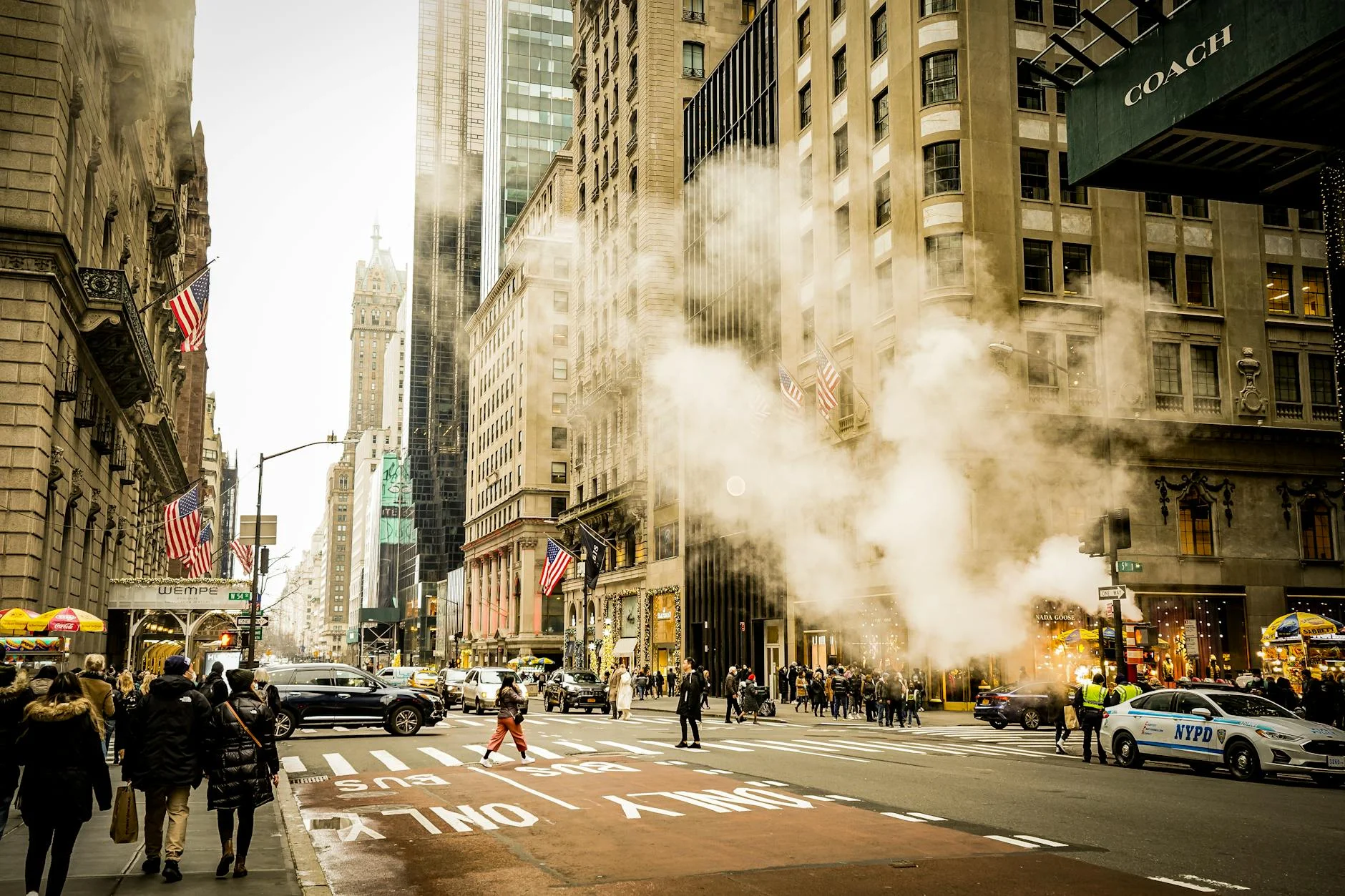Vibrant City Life: Steam Rising in the Urban Canyon