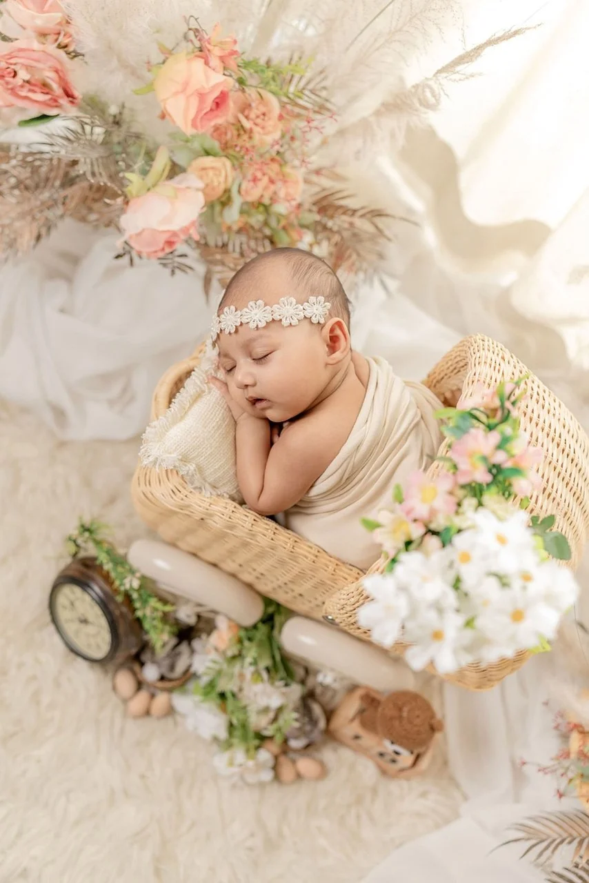 Sweet Dreams: Adorable Newborn Sleeping Amidst Flowers