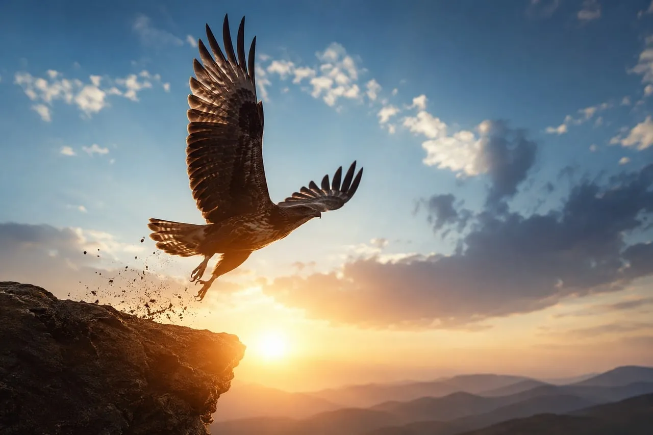 Majestic Eagle Soaring at Sunset Over Mountain Peaks