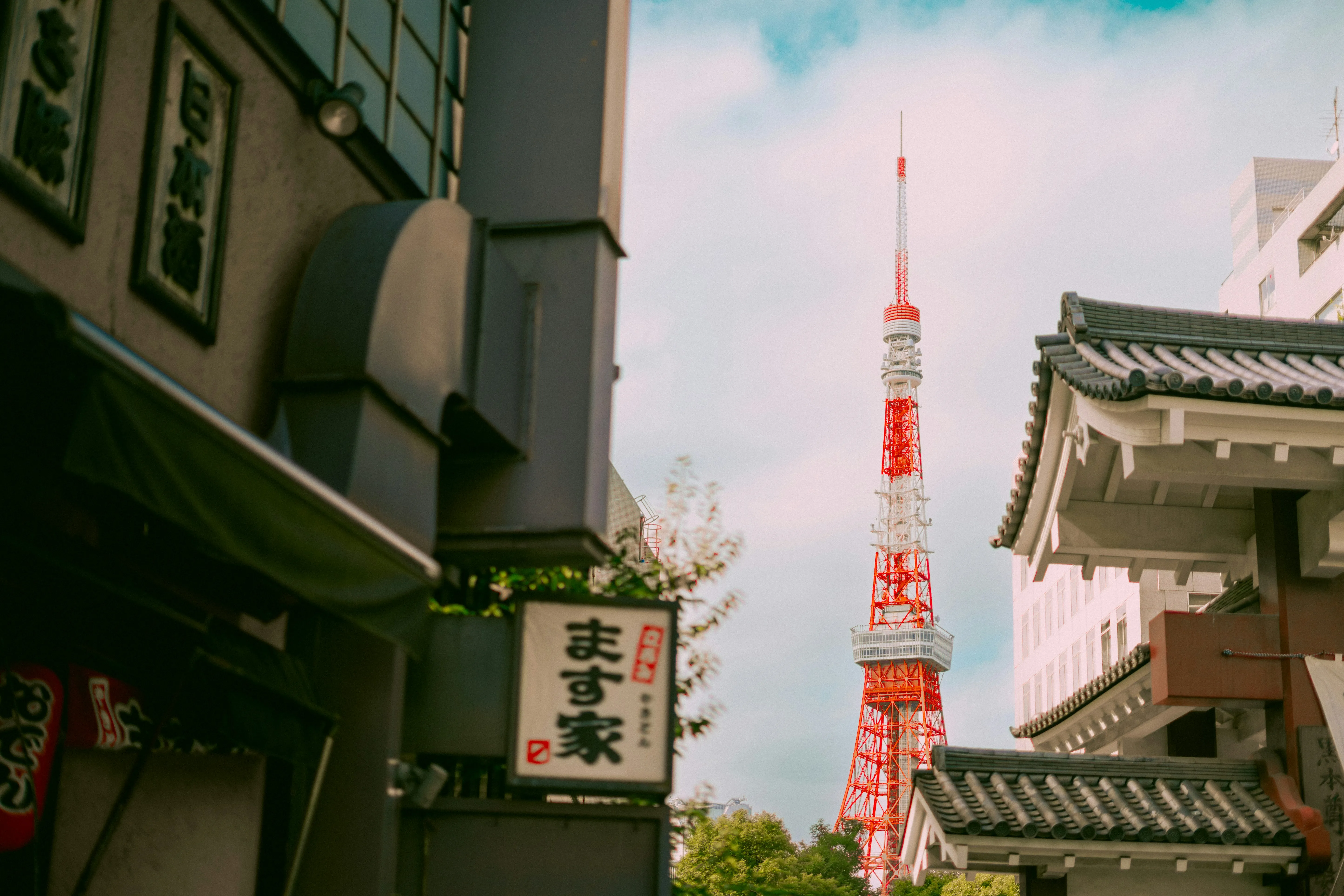 Iconic Tokyo Tower Peeking Through Traditional Japanese Architecture