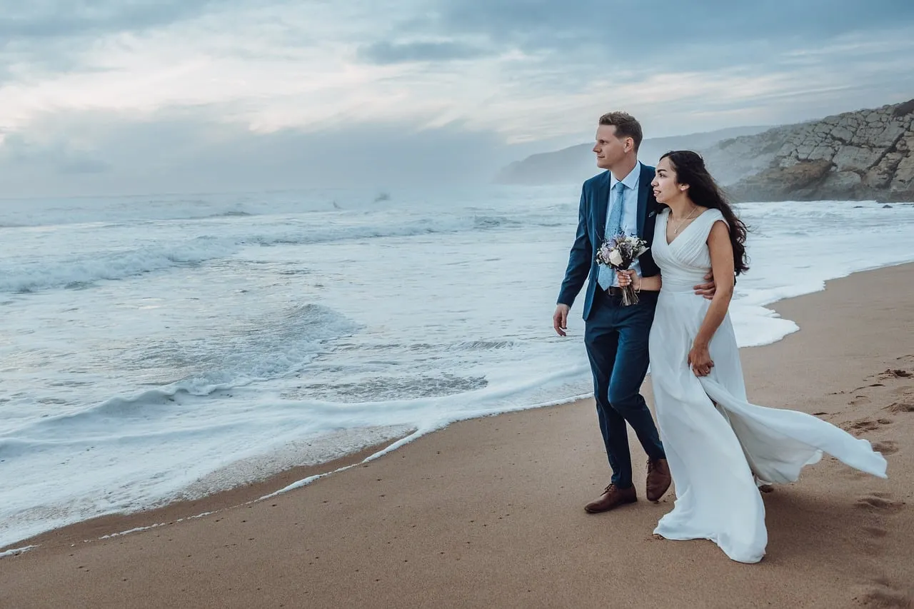 Romantic Beach Wedding: Couple's Seaside Stroll