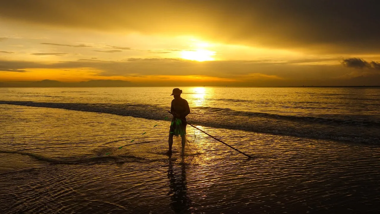 Golden Dawn: Fisherman's Solitude on the Vietnamese Coast