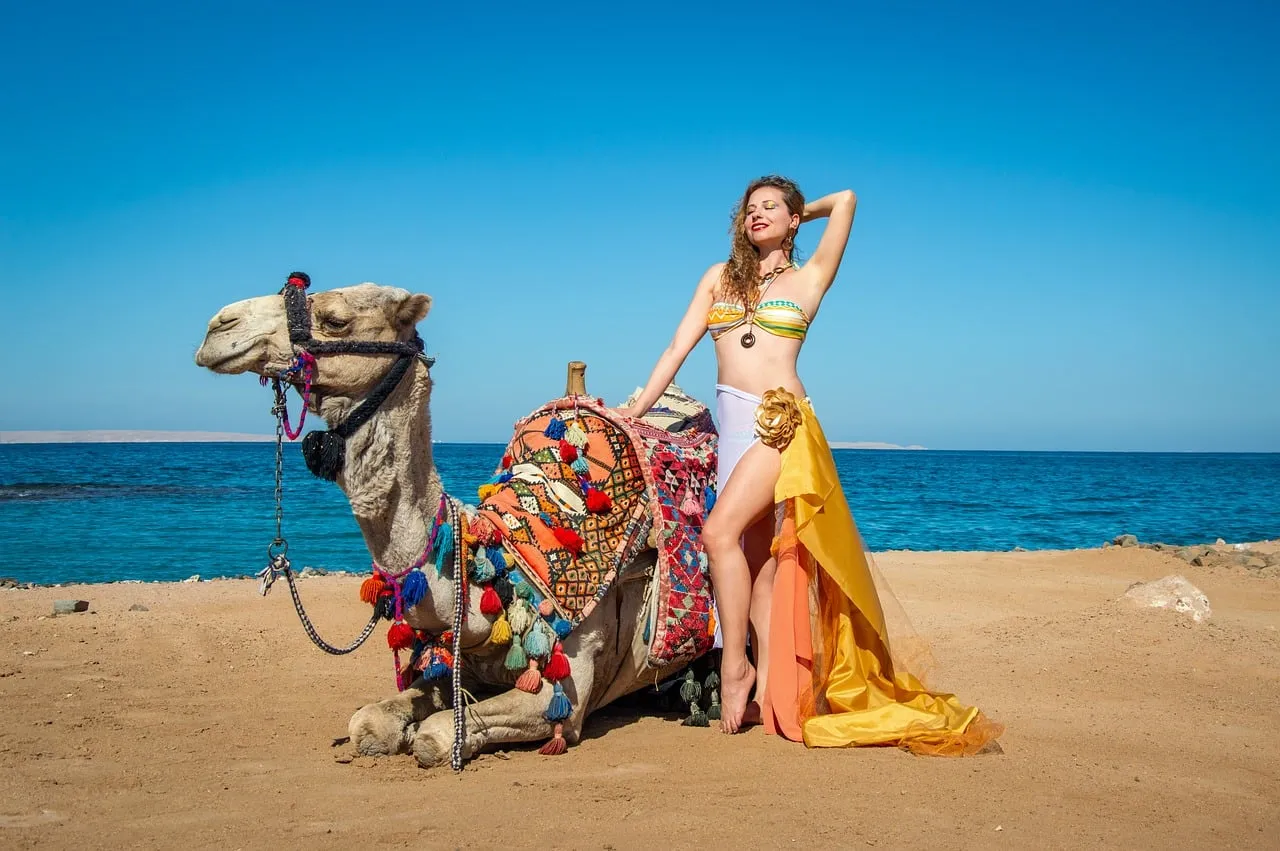 Exotic Desert Oasis: Woman, Camel, and Vibrant Beach Fashion
