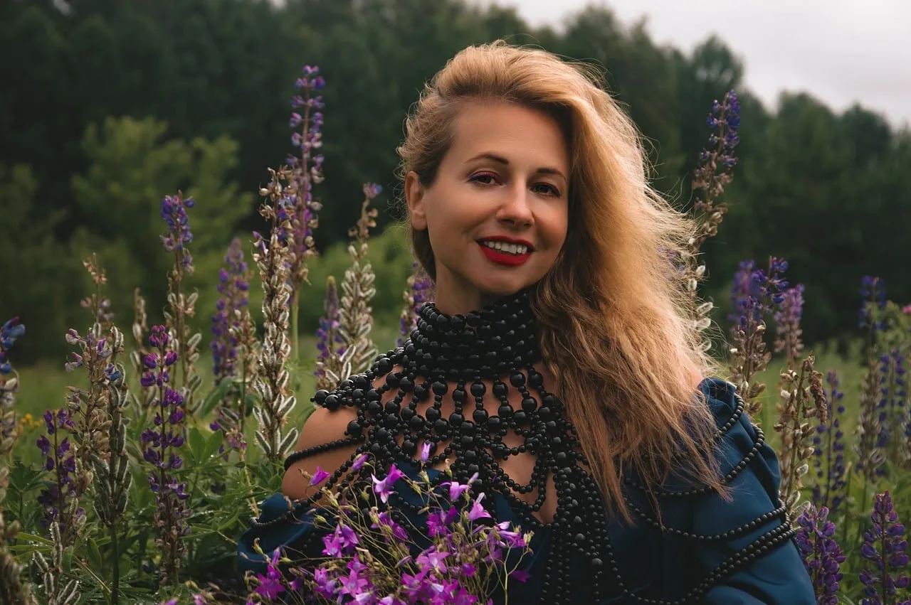 Radiant Blonde Woman Amidst Blooming Lupines