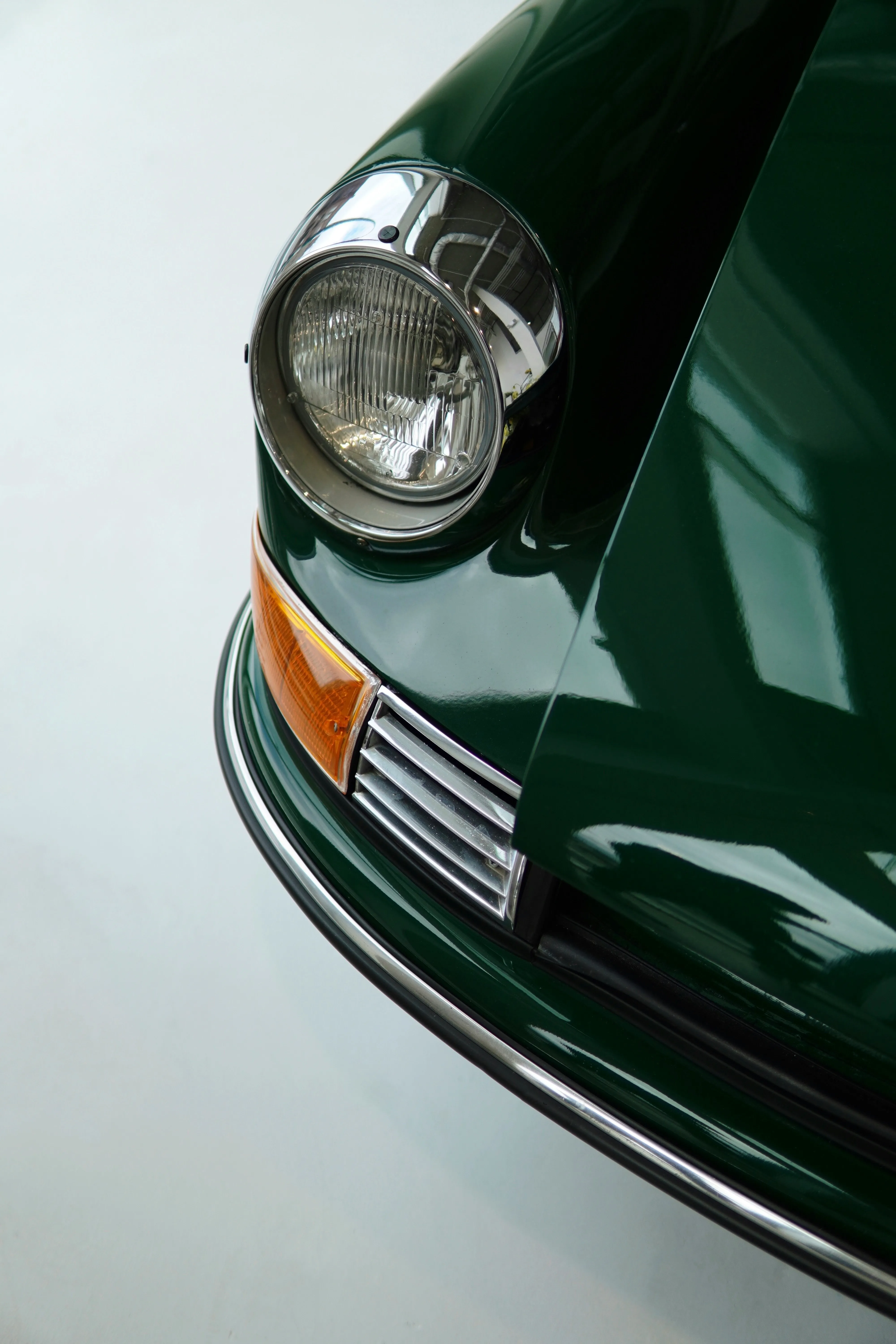 Timeless Elegance: Classic Green Car Headlight Detail