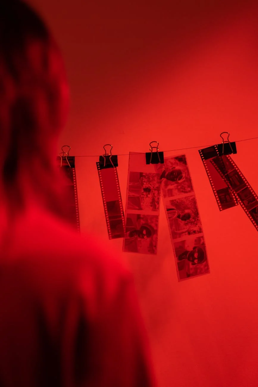 Vivid Red Darkroom: Film Negatives Drying