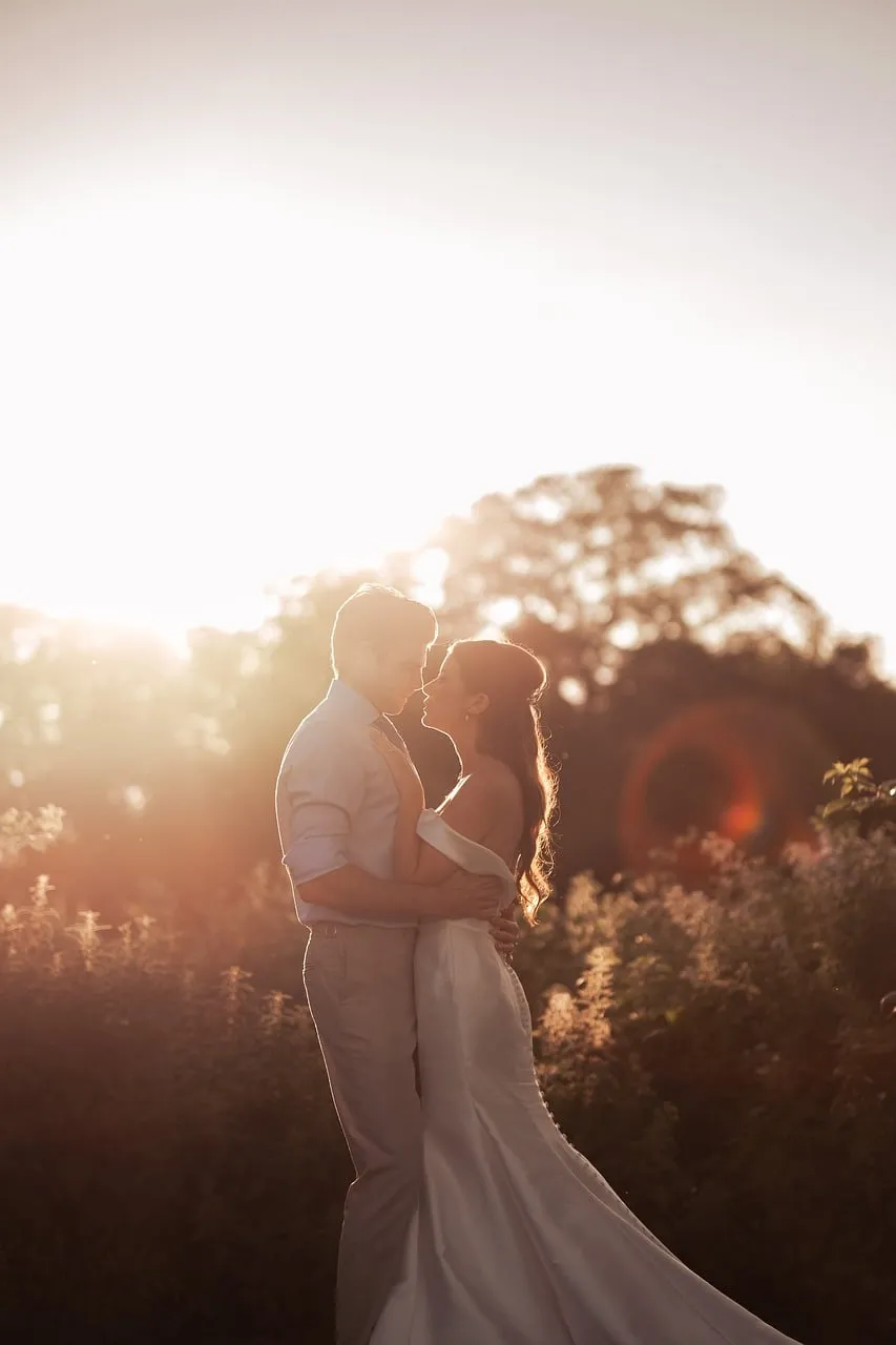 Enchanting Sunset Embrace: Romantic Wedding Portrait in Golden Light