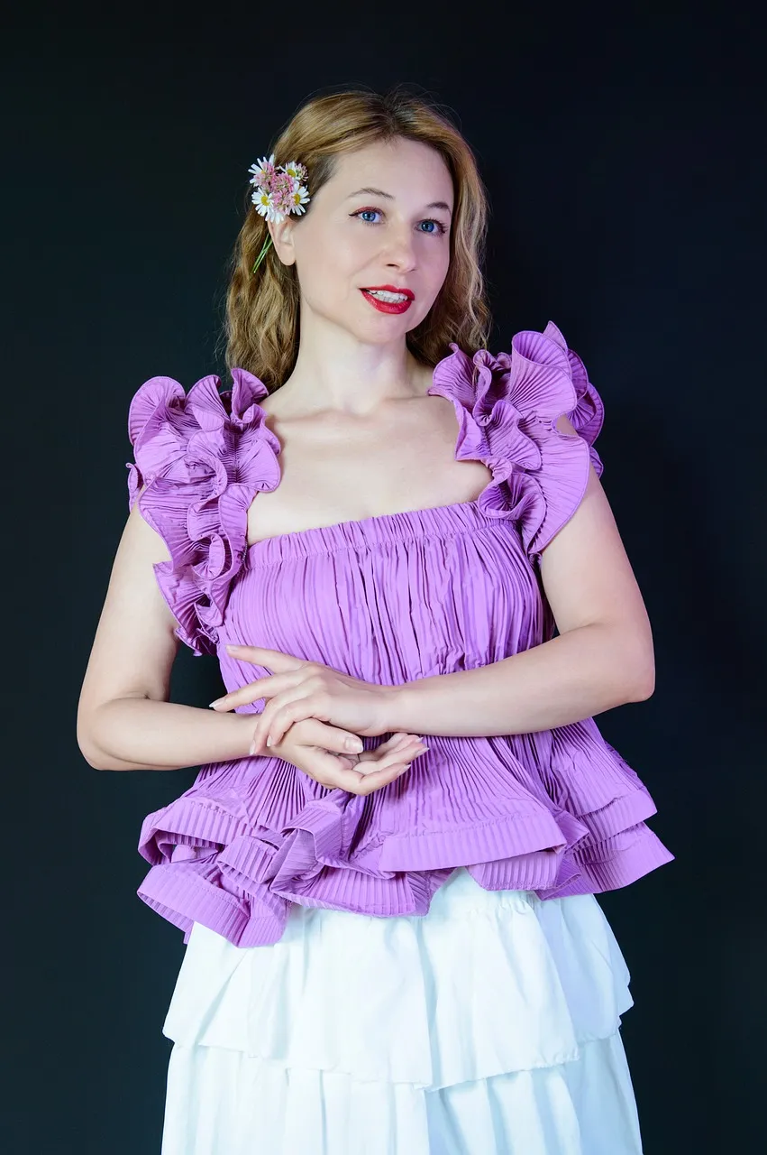 Elegant Blonde Woman in Vibrant Ruffled Blouse