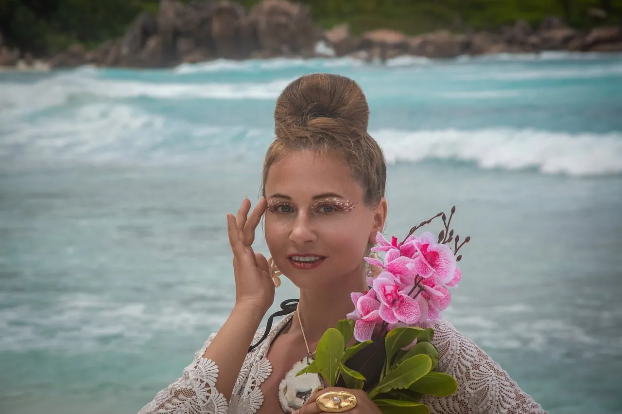 Enchanting Seychelles: Woman on Beach with Tropical Flowers