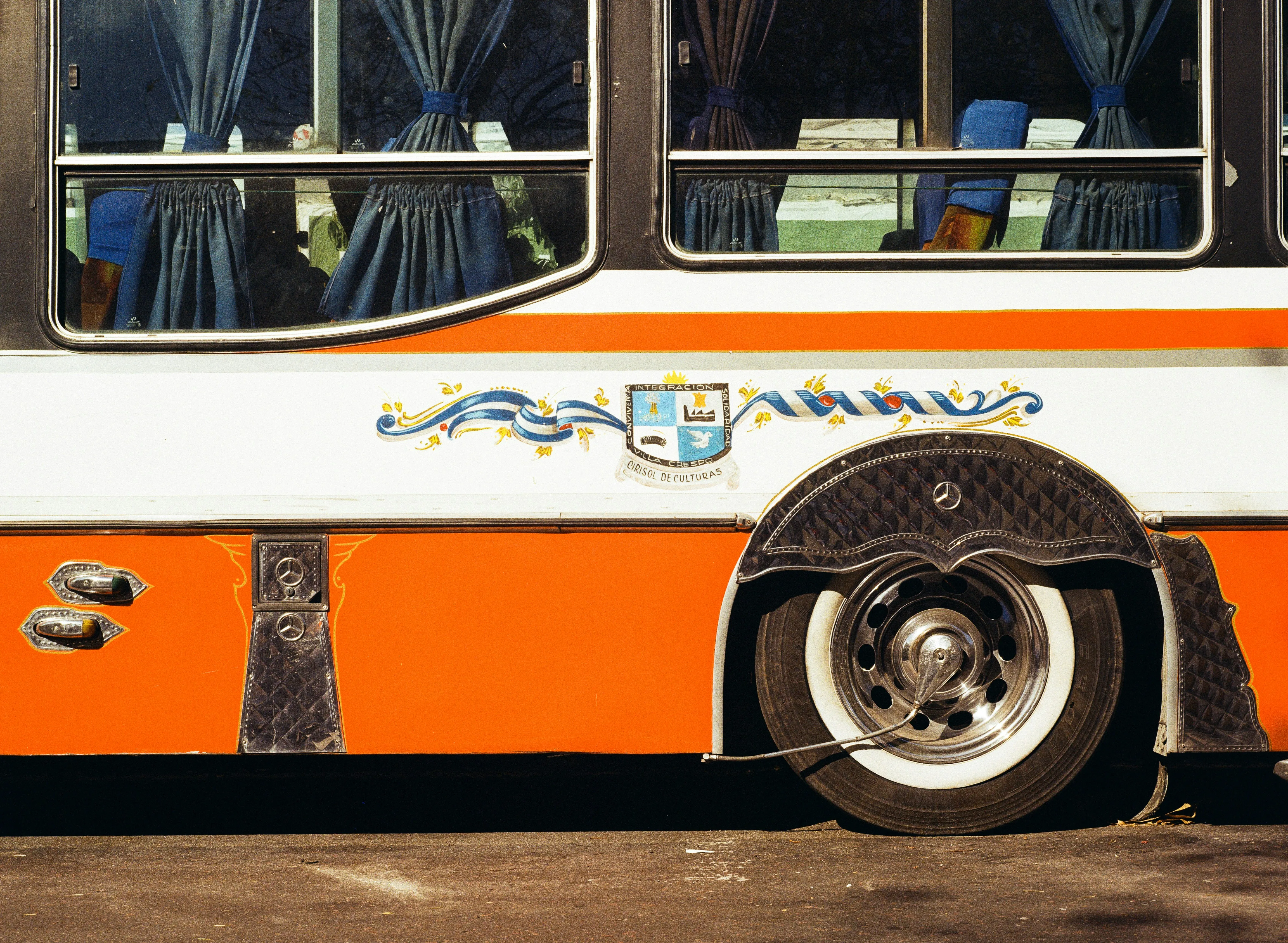Vibrant Vintage Charm: Orange Accents on a Classic Bus