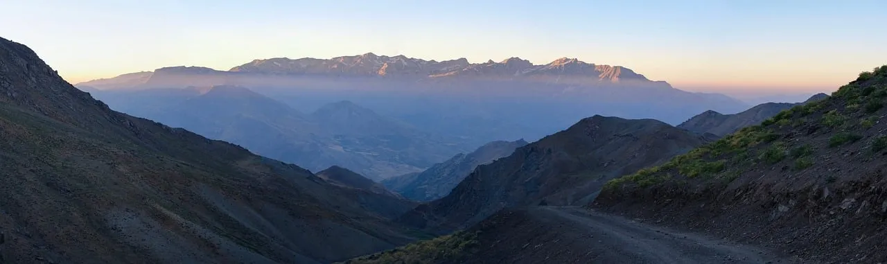 Breathtaking Mountain Dawn: Serene Peaks and Misty Valleys