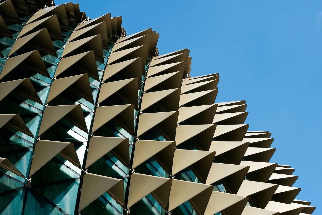 Striking Modern Architecture: Geometric Facade Against Blue Sky