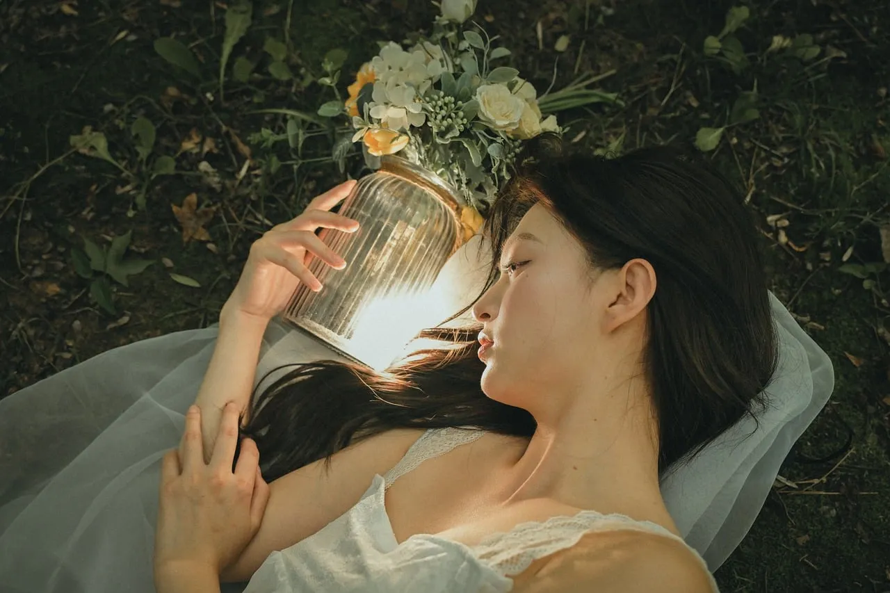Enchanting Spring Twilight: Woman Amidst Glowing Flowers
