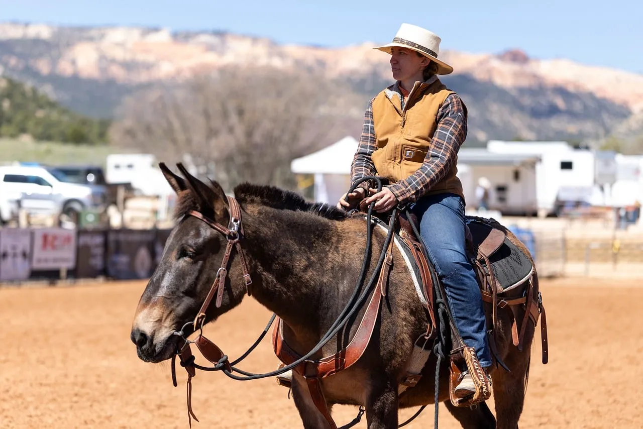 Rugged Beauty: Cowgirl & Mule in Western Landscape