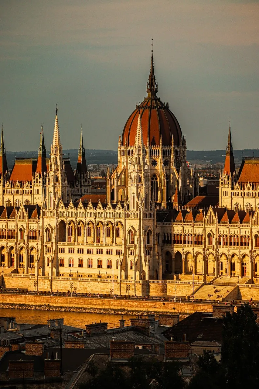 Golden Sunset Bathes Budapest Parliament in Historic Grandeur