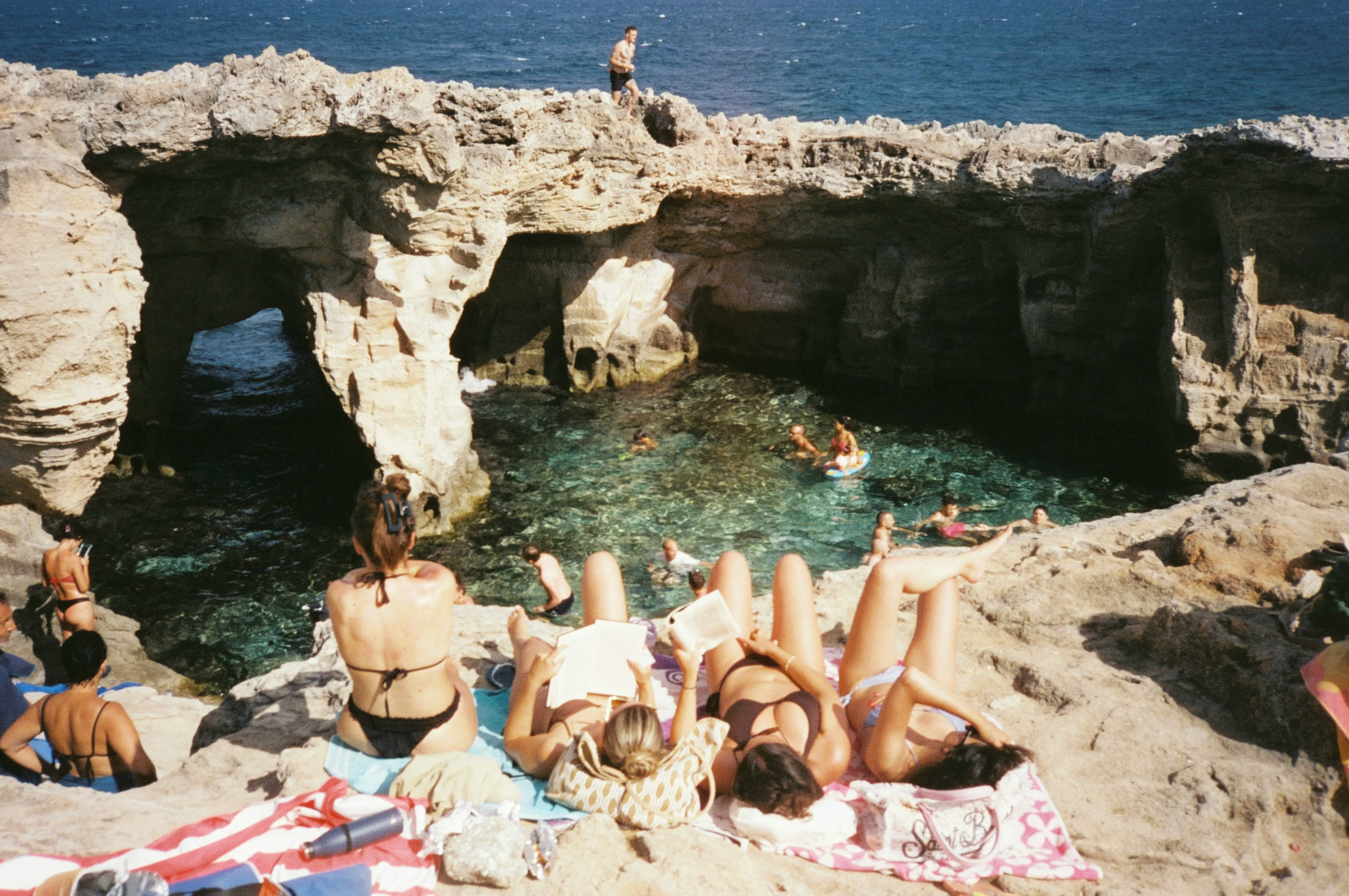 Sun-Kissed Bliss: Relaxing Day at a Scenic Coastal Grotto