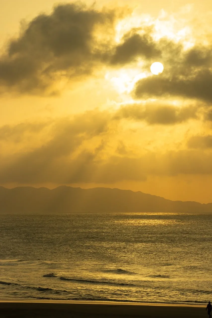 Dramatic Golden Sunset Over Calm Ocean Serenity