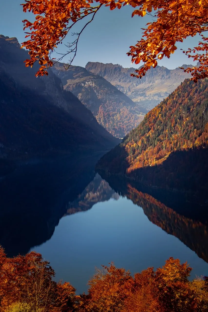 Breathtaking Autumn Sunset Reflection on Klöntalersee, Switzerland