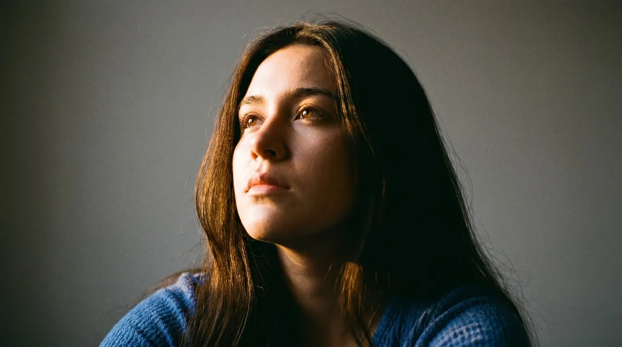 Stunning Natural Beauty: Contemplative Woman in Soft Light