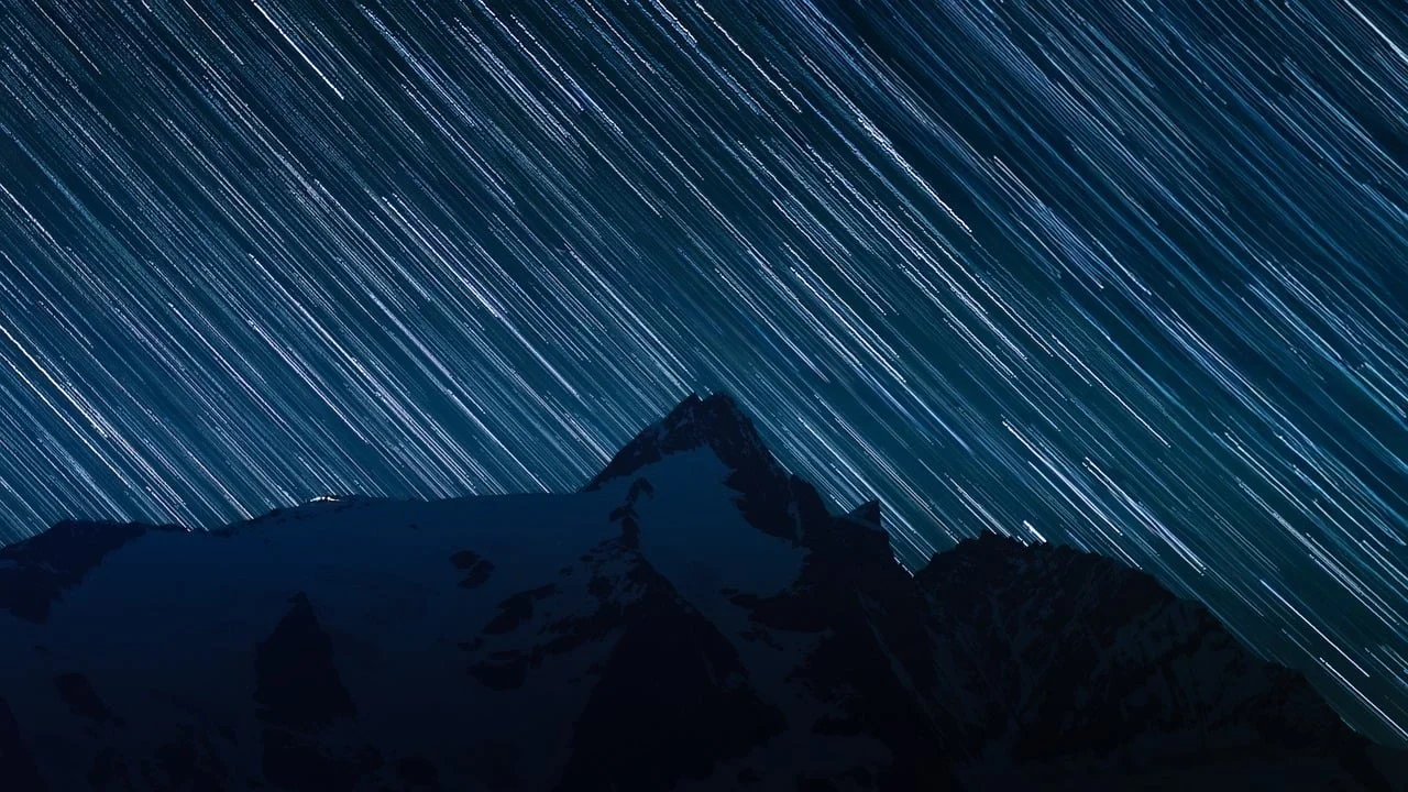 Celestial Symphony: Star Trails Over Majestic Mountains