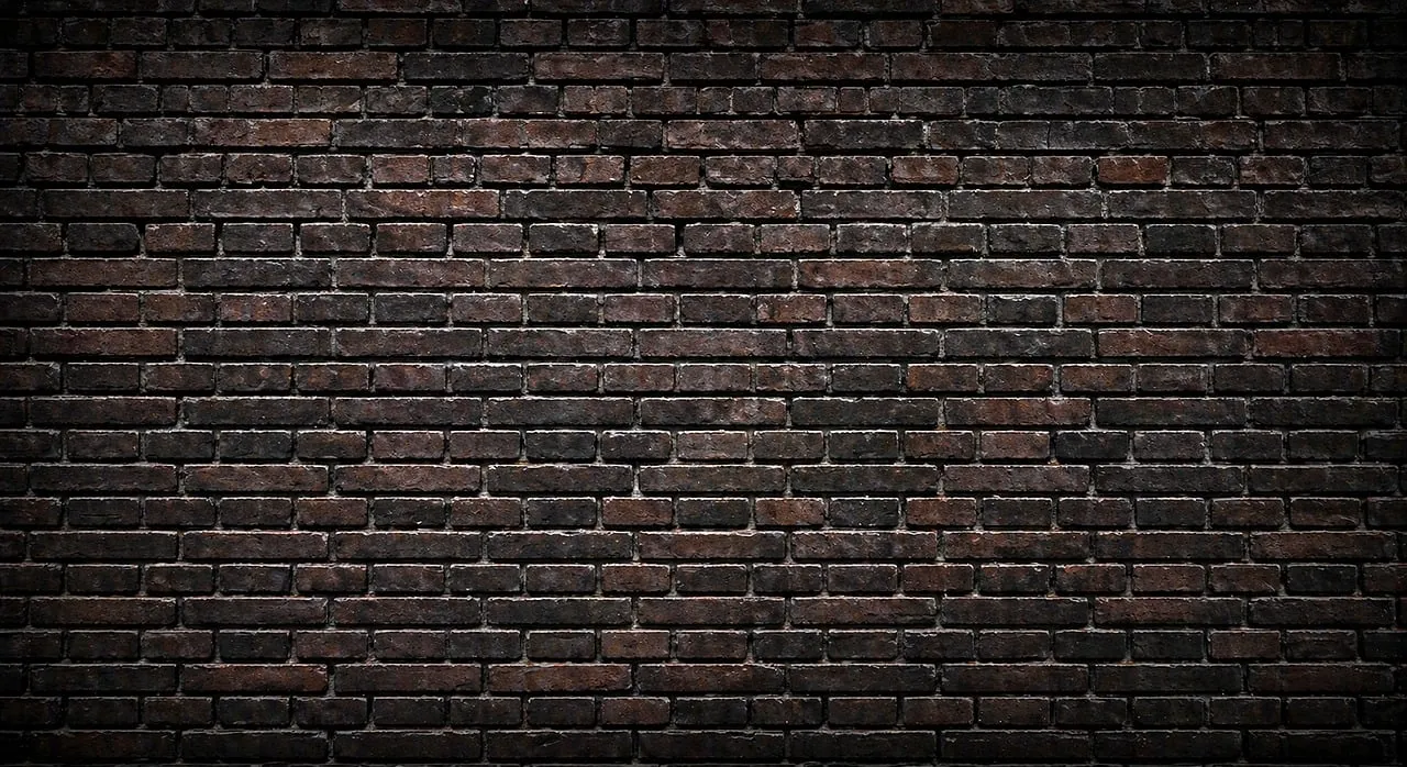 Dramatic Dark Brick Wall Texture: Urban Grunge Backdrop