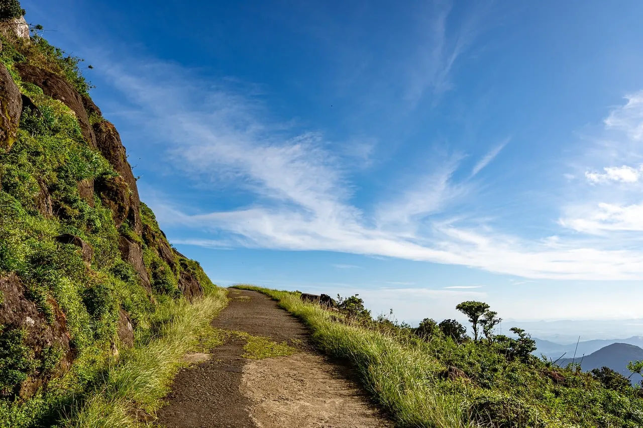 Breathtaking Mountain Path: Serene Hike Under Azure Skies