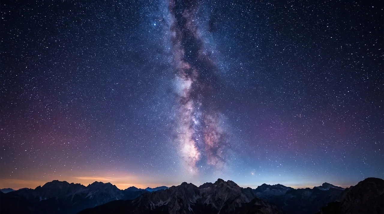 Celestial Grandeur: Milky Way Arching Over Majestic Peaks