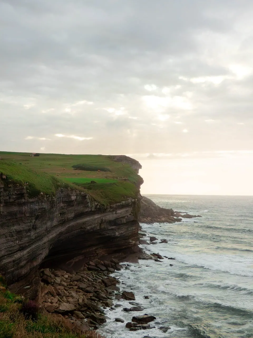 Dramatic Coastal Cliffs: Nature's Raw Beauty at Sunrise