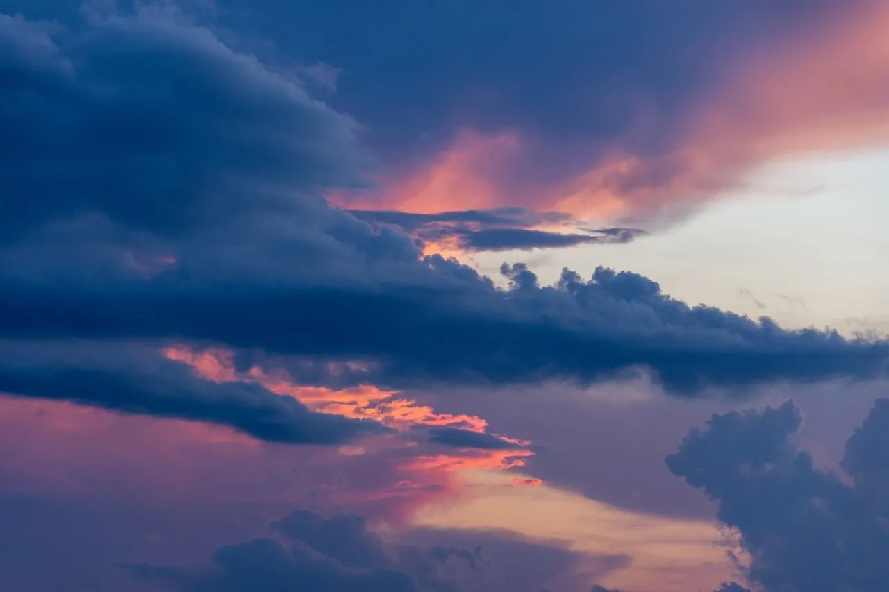Dramatic Twilight: Storm Clouds Paint the Sunset Sky