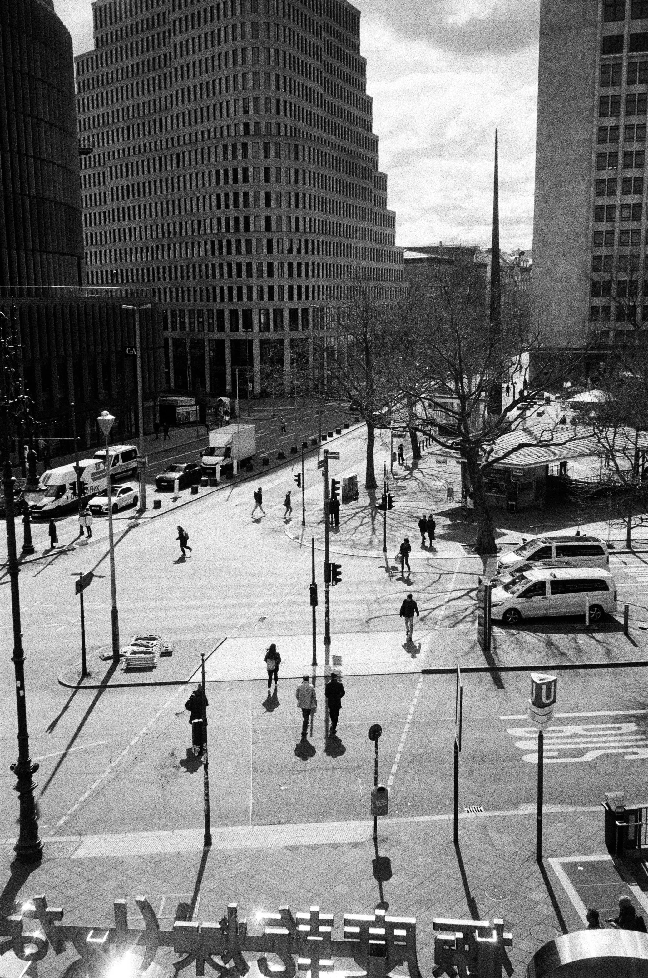 Dynamic Urban Life: People Crossing a Bustling City Street