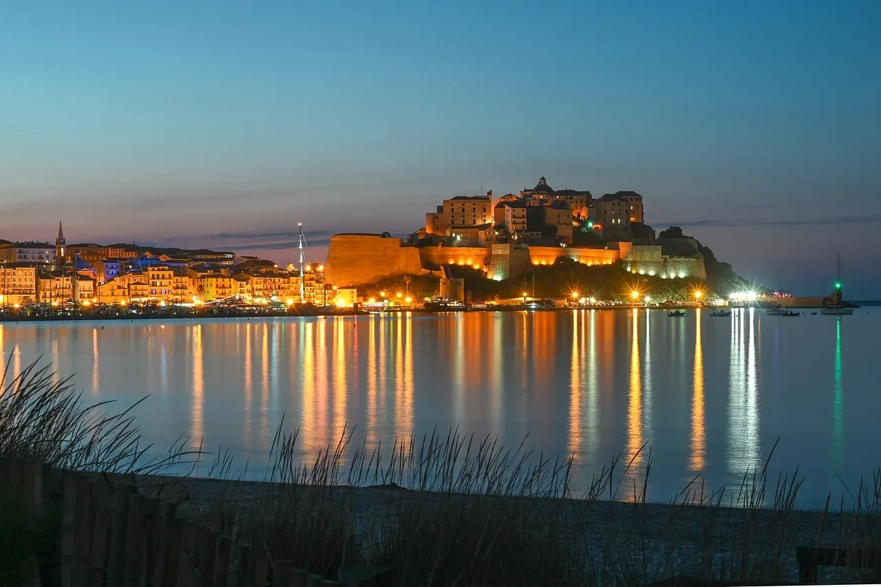 Enchanting Calvi Citadel: Evening Glow over Corsica Harbor