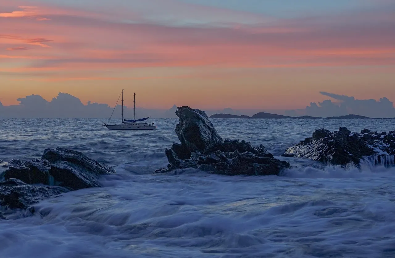 Dramatic Sunset Seascape with Yacht and Crashing Waves