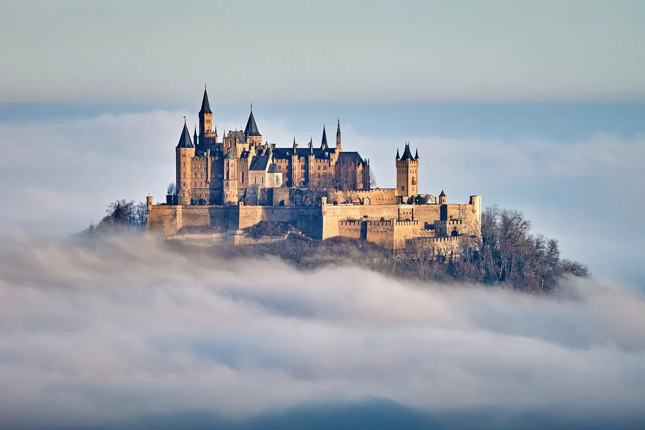 Majestic Hohenzollern Castle Rises from Misty Dawn