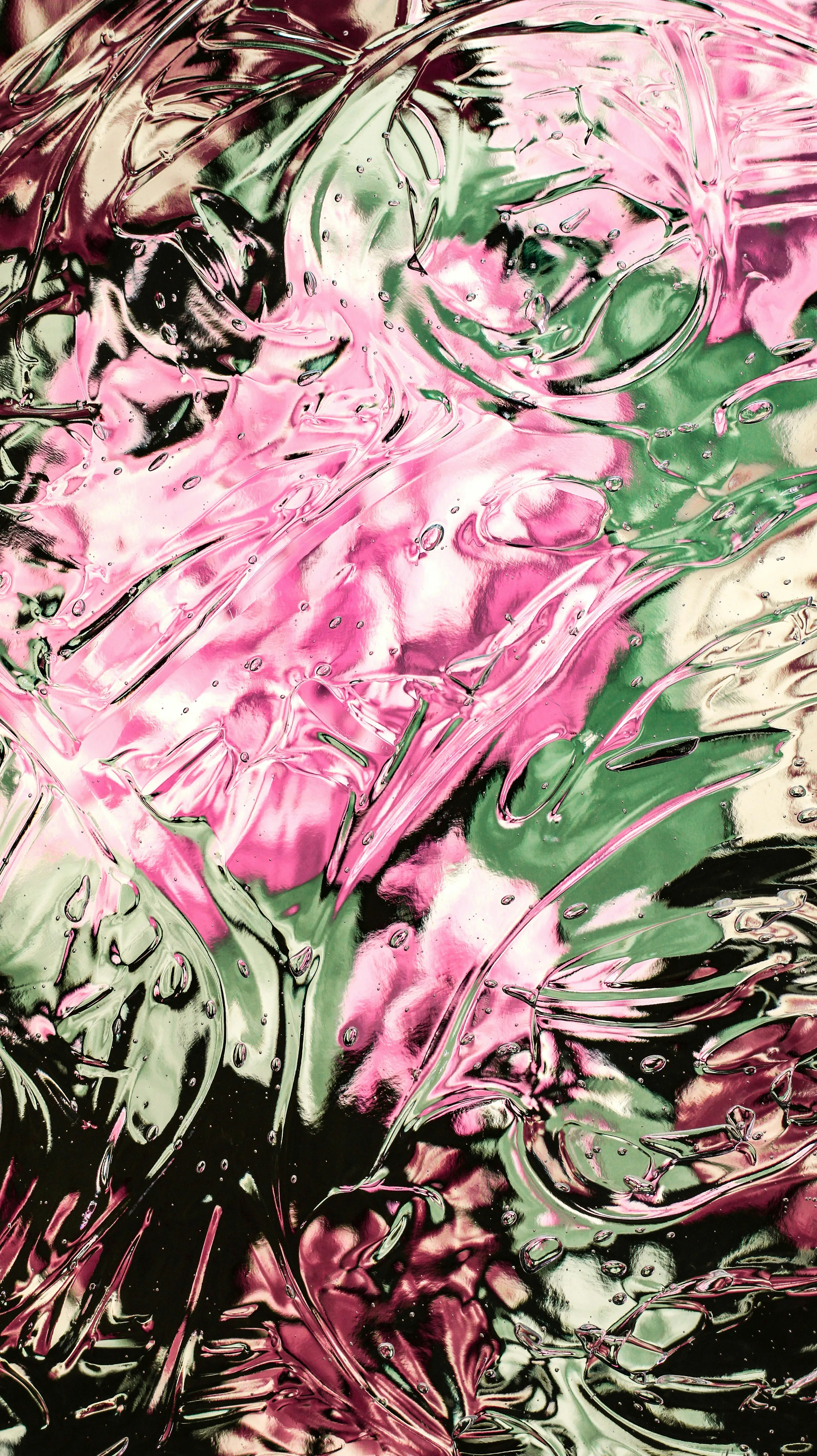 Vibrant Abstract: Pink and Green Glassy Texture